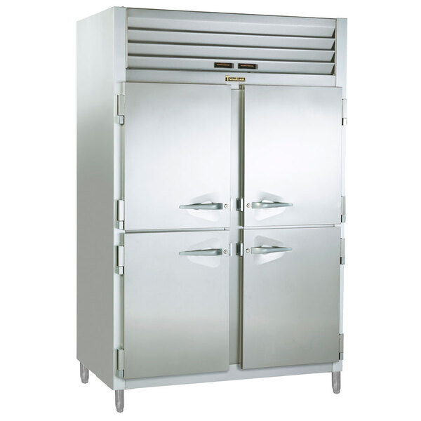 A large white Traulsen refrigerator with two half doors.
