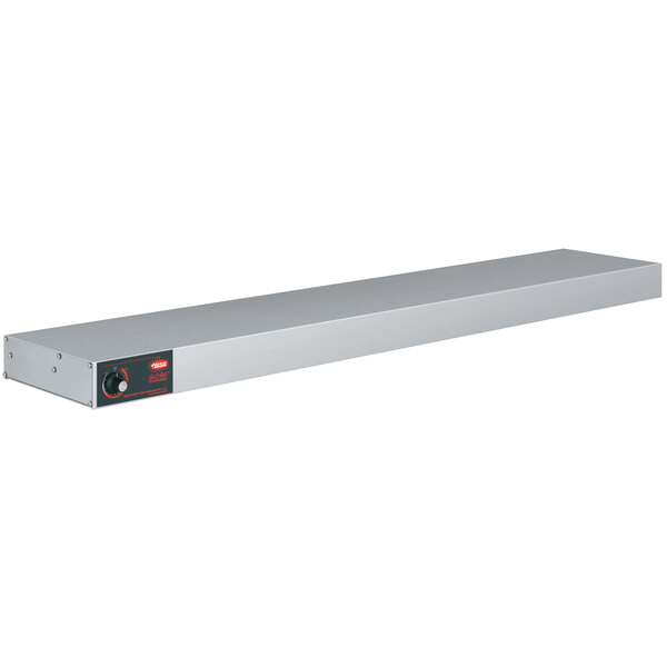 A white rectangular Hatco infrared warmer with a red light on a metal shelf.
