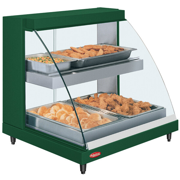 A green Hatco countertop food warmer with trays of food displayed.