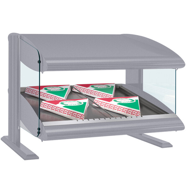 A Hatco countertop display case with pizza boxes in it.