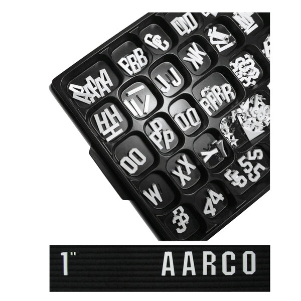 A black tray with white Aarco Gothic style letters and numbers.
