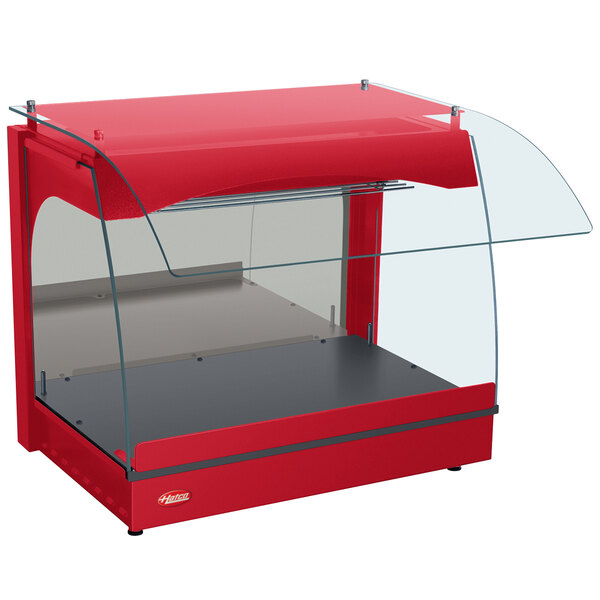 A red Hatco curved merchandising warmer with a clear glass top.