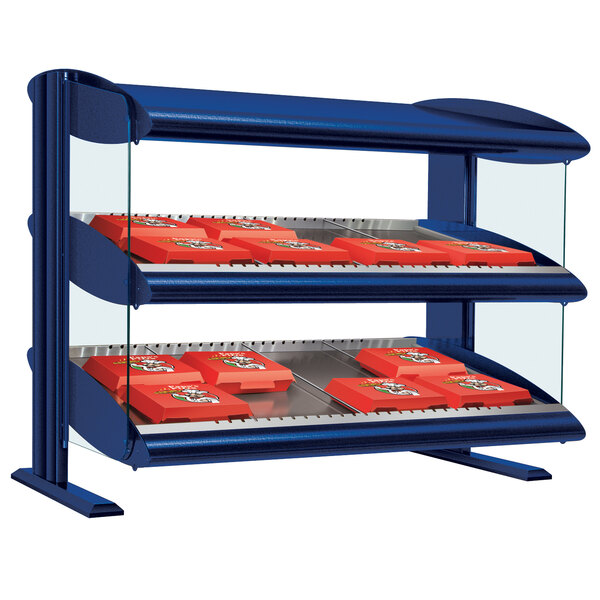 A navy blue slanted shelf merchandiser on a counter in a bakery display.