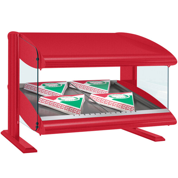 A red Hatco countertop warmer with pizza boxes on a slanted shelf.