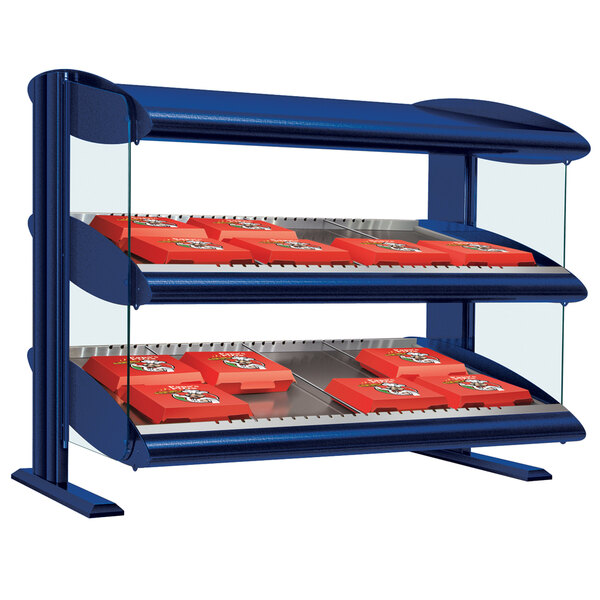 A navy blue slanted single shelf display case on a counter with red boxes.