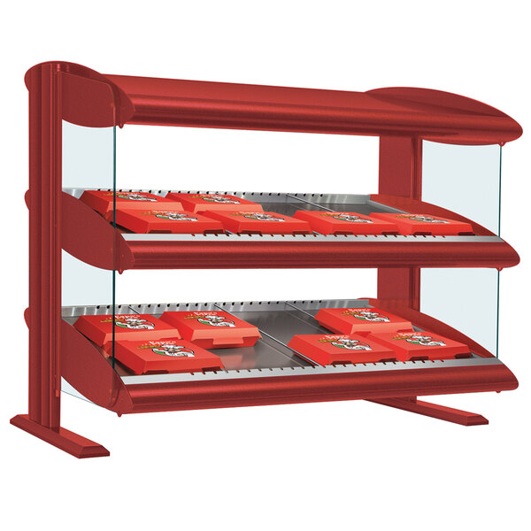 A red Hatco countertop display case with a slanted shelf holding food.