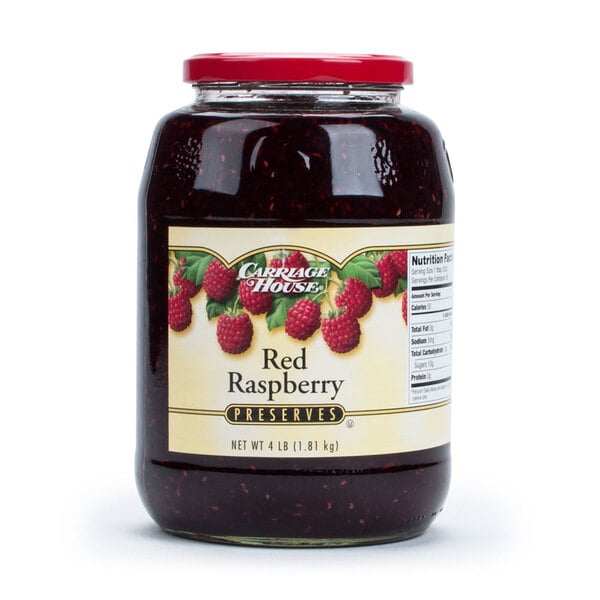 A 4 lb. glass jar of red raspberry preserves with a label.