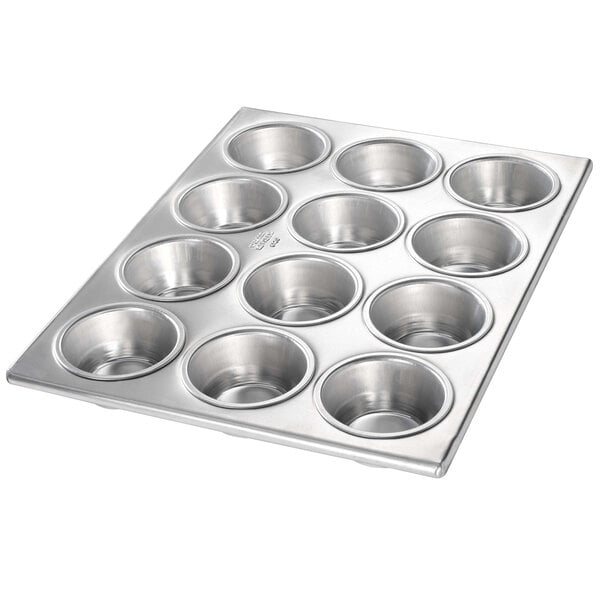A silver Chicago Metallic muffin pan with 12 cupcake holders.