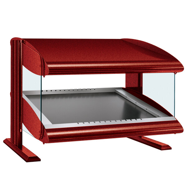 A red food warmer with a glass top.