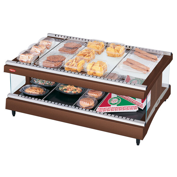 A Hatco countertop heated glass display case with food on a tray.