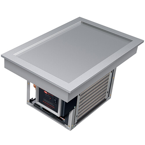 A rectangular metal box with a rectangular top on a Hatco Frost Top.