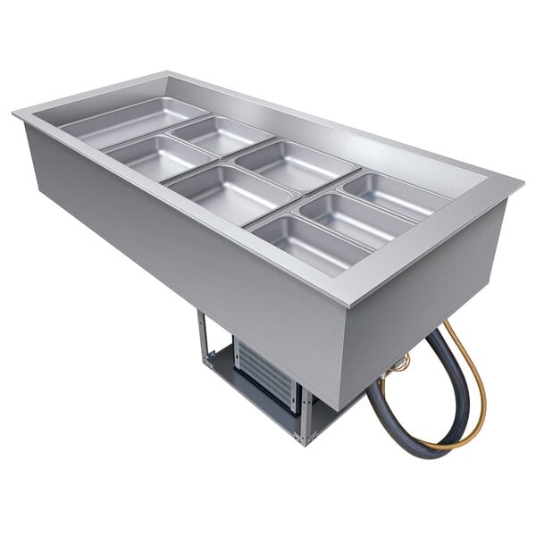 A large rectangular stainless steel container with four compartments.