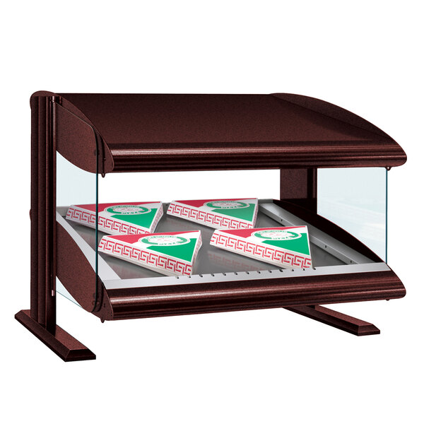 A Hatco slanted heated zone countertop display case with pizza boxes inside.