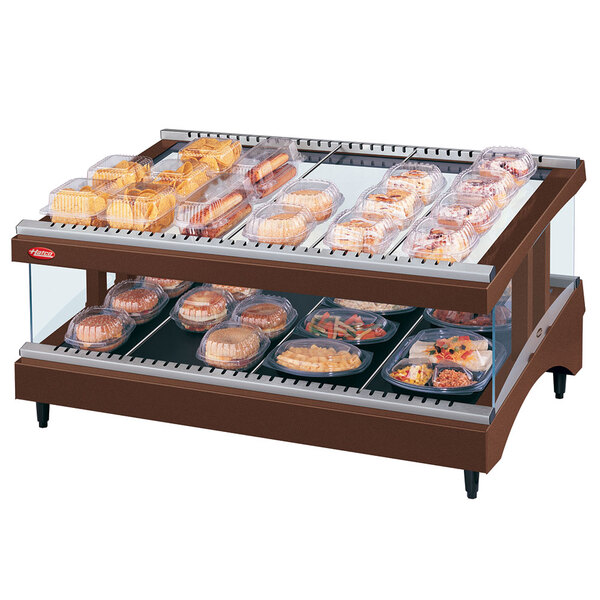 A Hatco countertop heated glass display case with food in it.