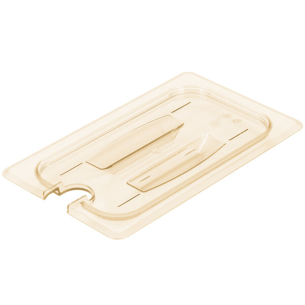 A Cambro amber plastic container lid with a handle and spoon notch.