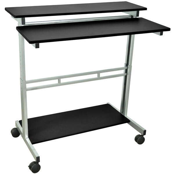 A black and silver Luxor stand up computer desk with wheels.