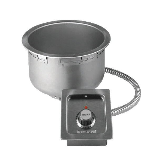 A silver Wells insulated round drop-in soup well with a thermostatic control and a drain hose.