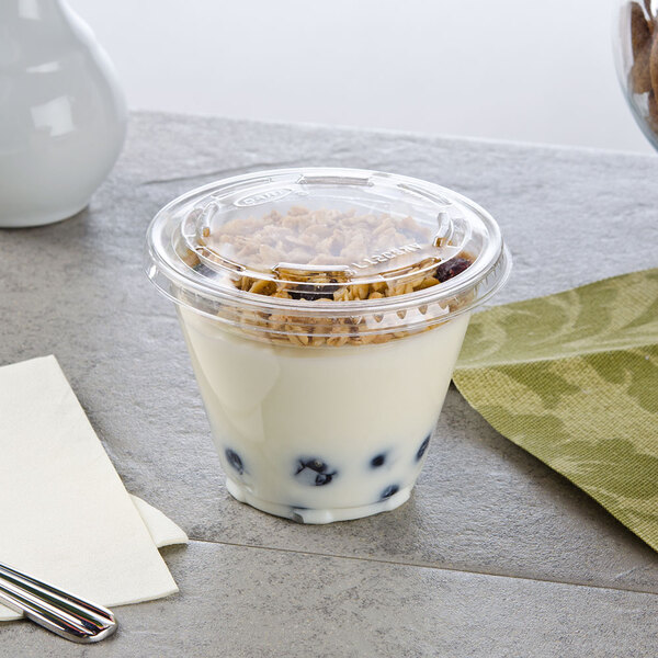 A Squat Parfait Cup with yogurt, blueberries, and cereal on top.