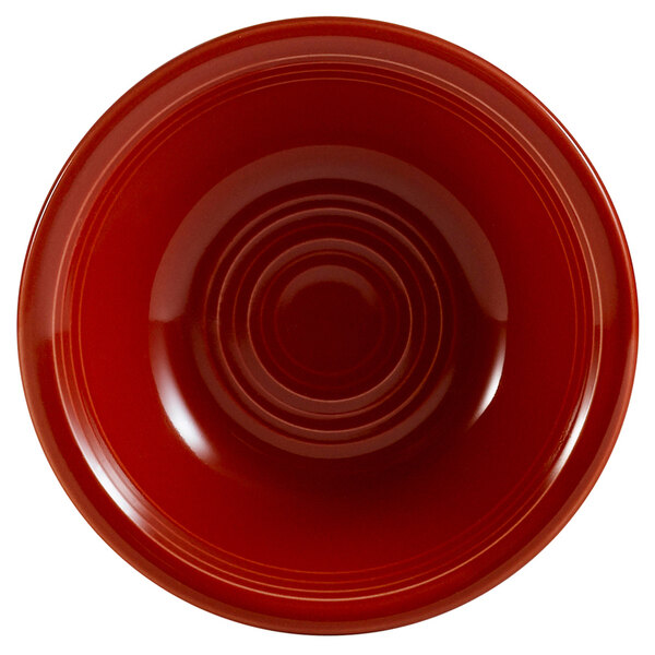 A red CAC Tango fruit bowl with a white circular center.