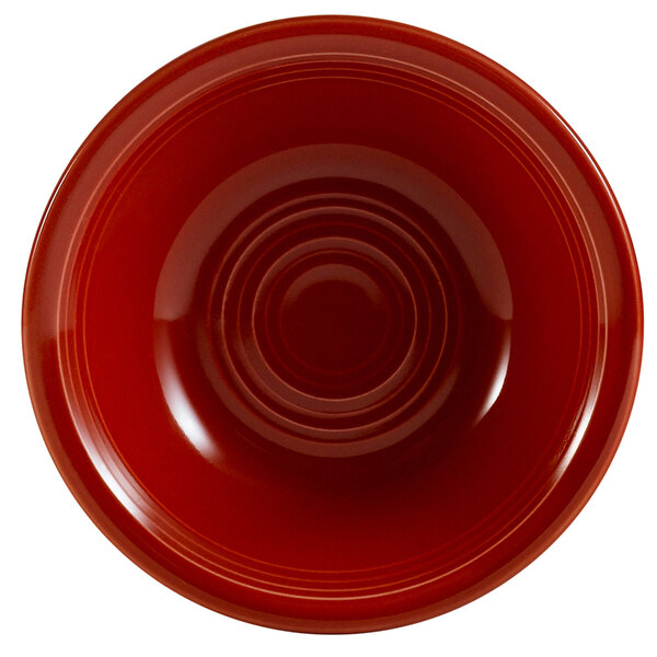 A close-up of a red CAC Tango fruit bowl with a rim.