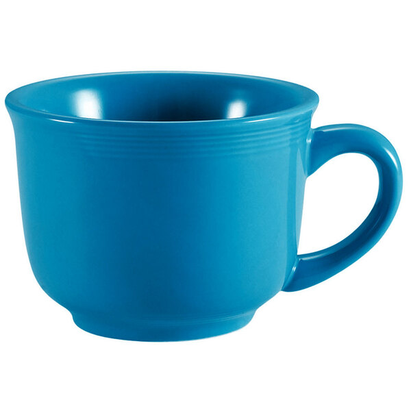 A blue CAC Tango coffee cup with a handle.