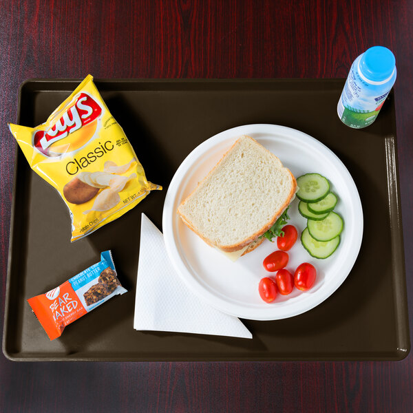 A tray with a plate of food, a sandwich, and a drink.