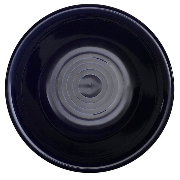 A black bowl with blue lines spiraling around the inside.