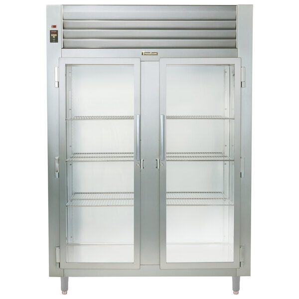 A Traulsen Specification Line two section glass door refrigerator with a stainless steel exterior.