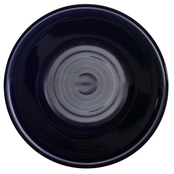 A black bowl with a circular pattern on it.