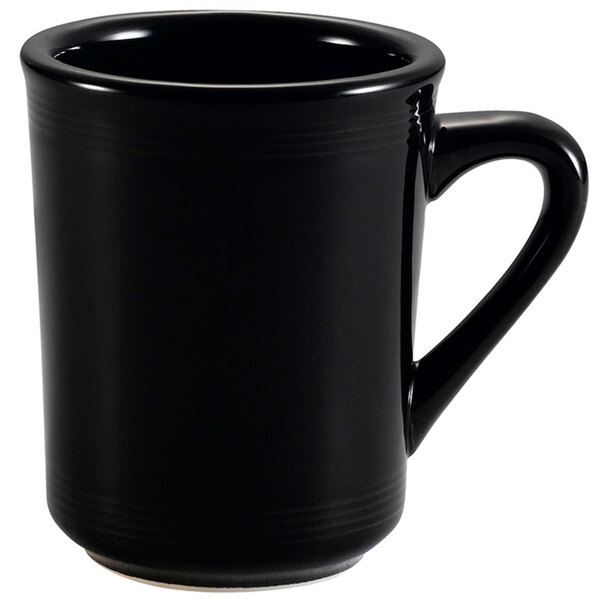 A CAC black coffee mug with a handle.