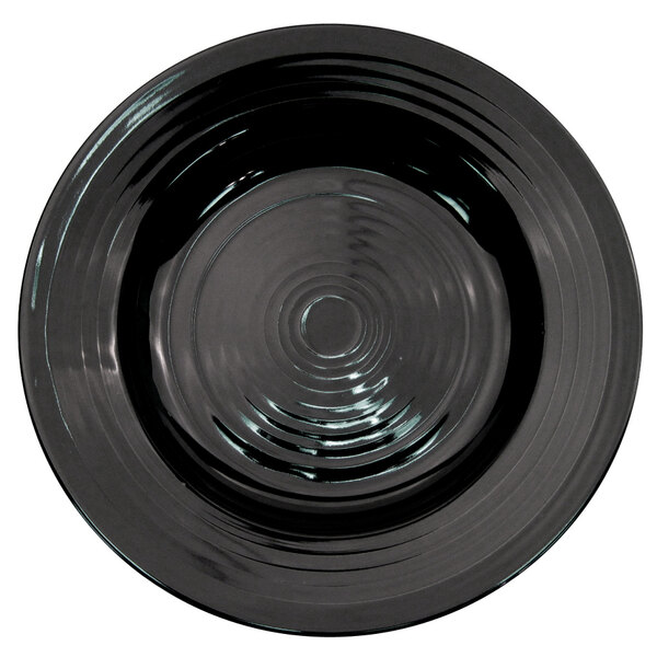 A black CAC Tango pasta bowl with a circular design on it.