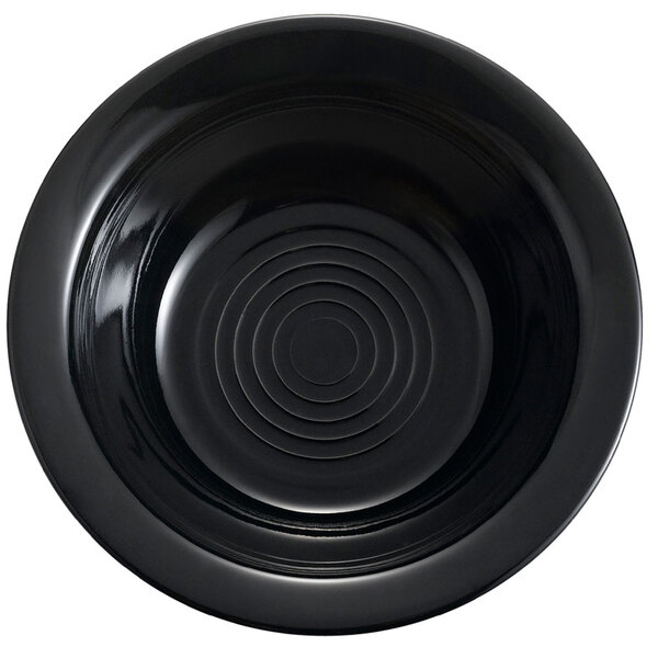 A black CAC Tango grapefruit bowl with a spiral pattern.