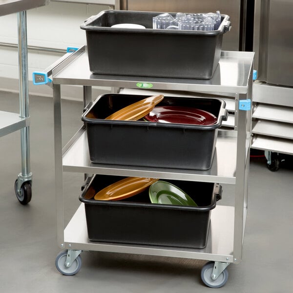 A Lakeside stainless steel utility cart with black trays on it.