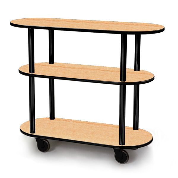 A Geneva oval serving cart with three shelves and a maple finish on a black frame with wheels.