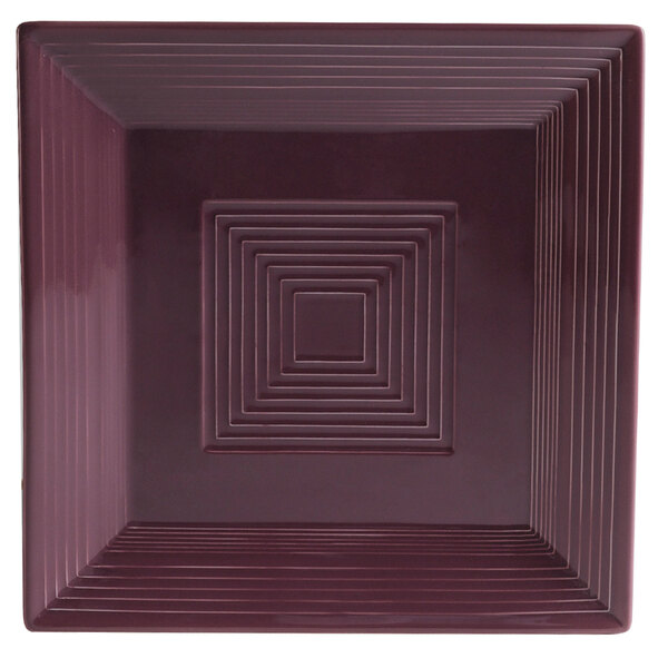 A CAC square plum plate with a square design in it.