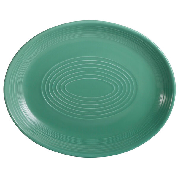 A green oval platter with a white spiral pattern.