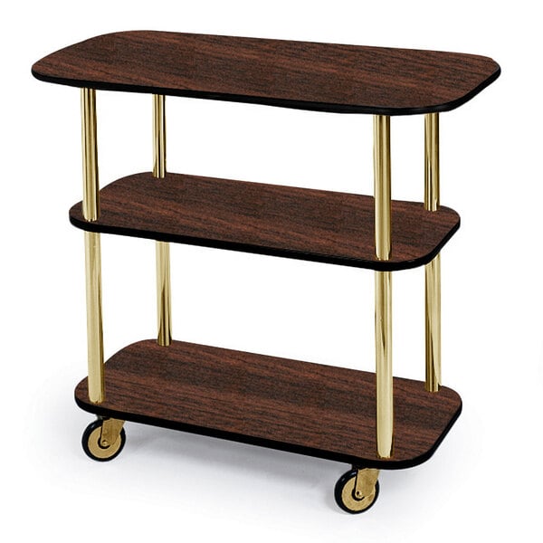 A Geneva rectangular serving cart with three mahogany shelves and wheels.