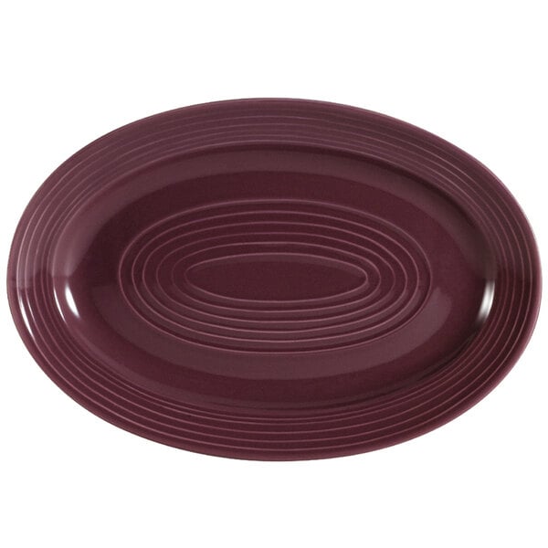 A CAC plum oval platter with a purple rim.