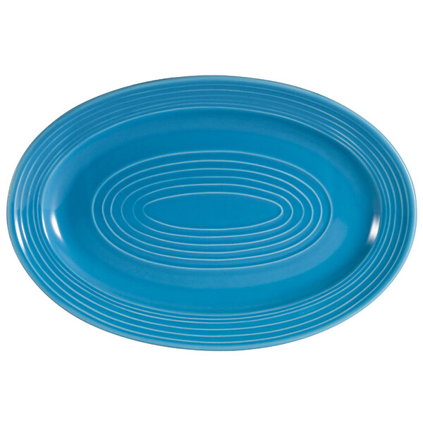 A blue oval platter with white lines and circles.