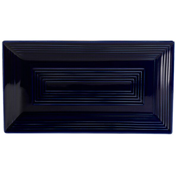 A blue rectangular CAC China platter with a blue border.