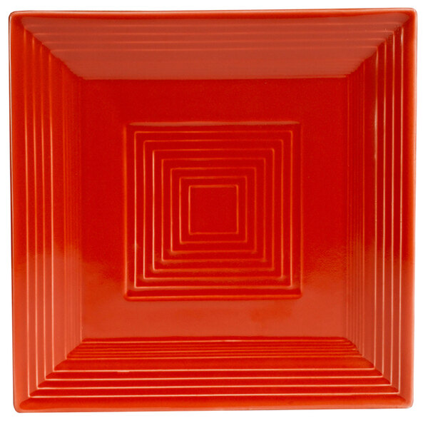 A CAC red square porcelain plate with white lines.