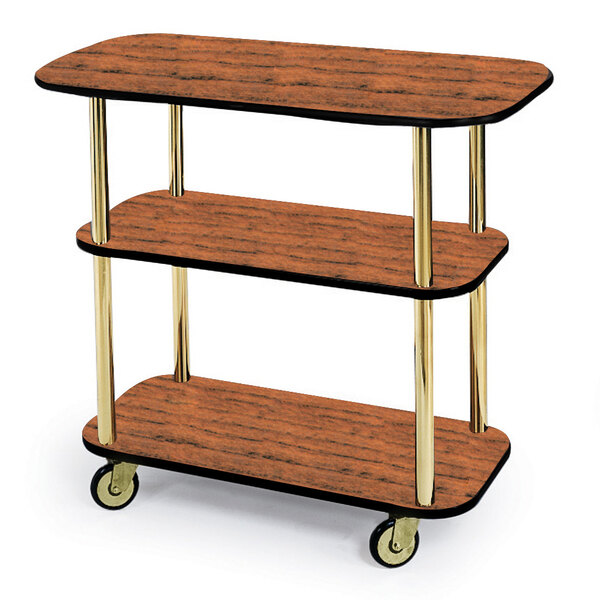 A Geneva rectangular wood serving cart with three tiers on wheels.