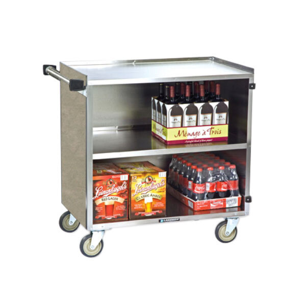 A Lakeside stainless steel utility cart with an enclosed base holding wine and soda bottles.