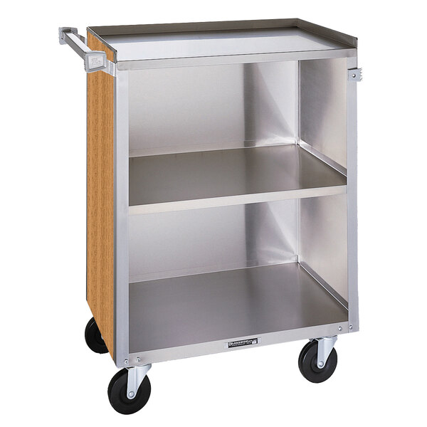 A Lakeside stainless steel utility cart with two shelves and a light maple enclosed base.