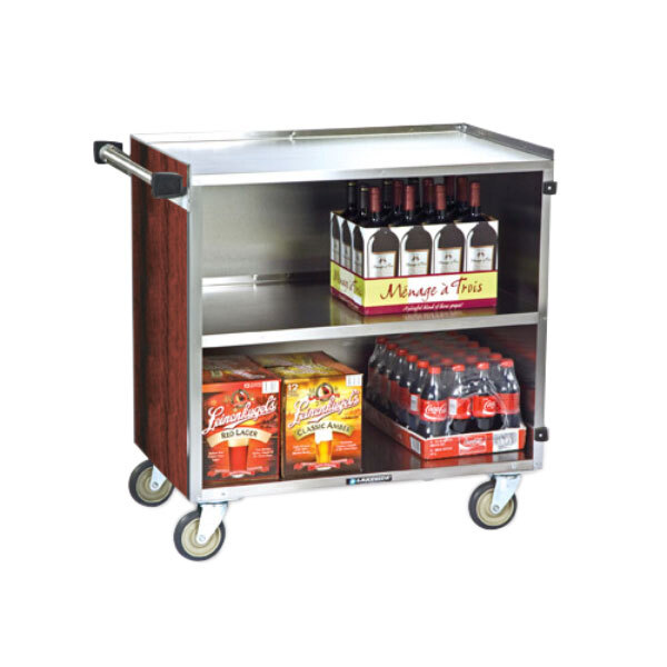 A Lakeside stainless steel utility cart with bottles of wine, soda, and snacks on it.