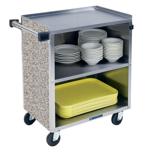A Lakeside stainless steel utility cart with plates on it.