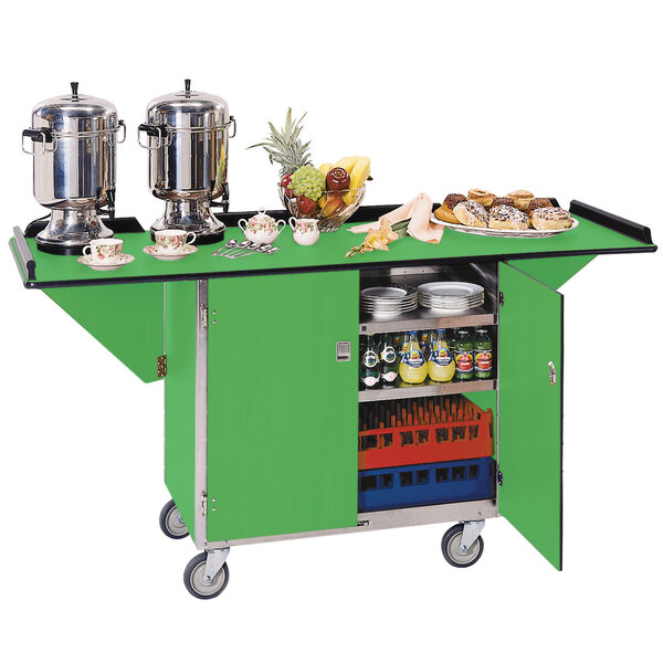 A Lakeside stainless steel drop-leaf beverage service cart with green shelves holding food.