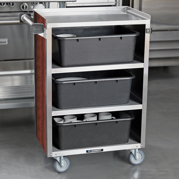 A Lakeside metal utility cart with black containers on the shelves.