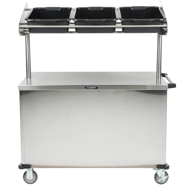 A stainless steel Lakeside vending cart with black trays.