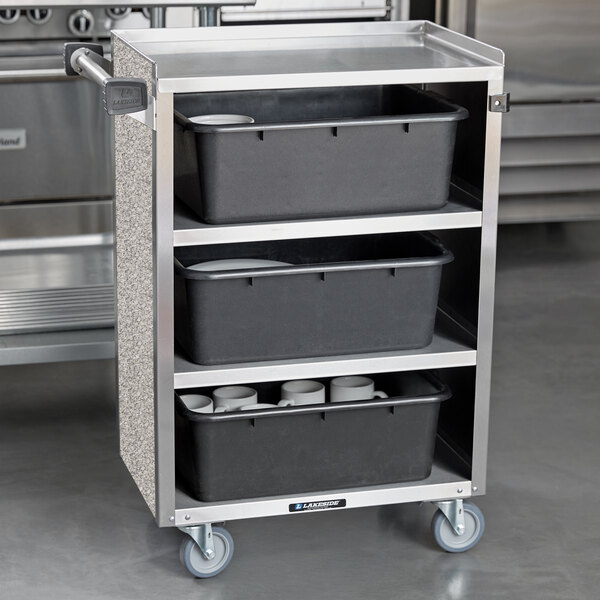 A Lakeside stainless steel utility cart with black containers on it.